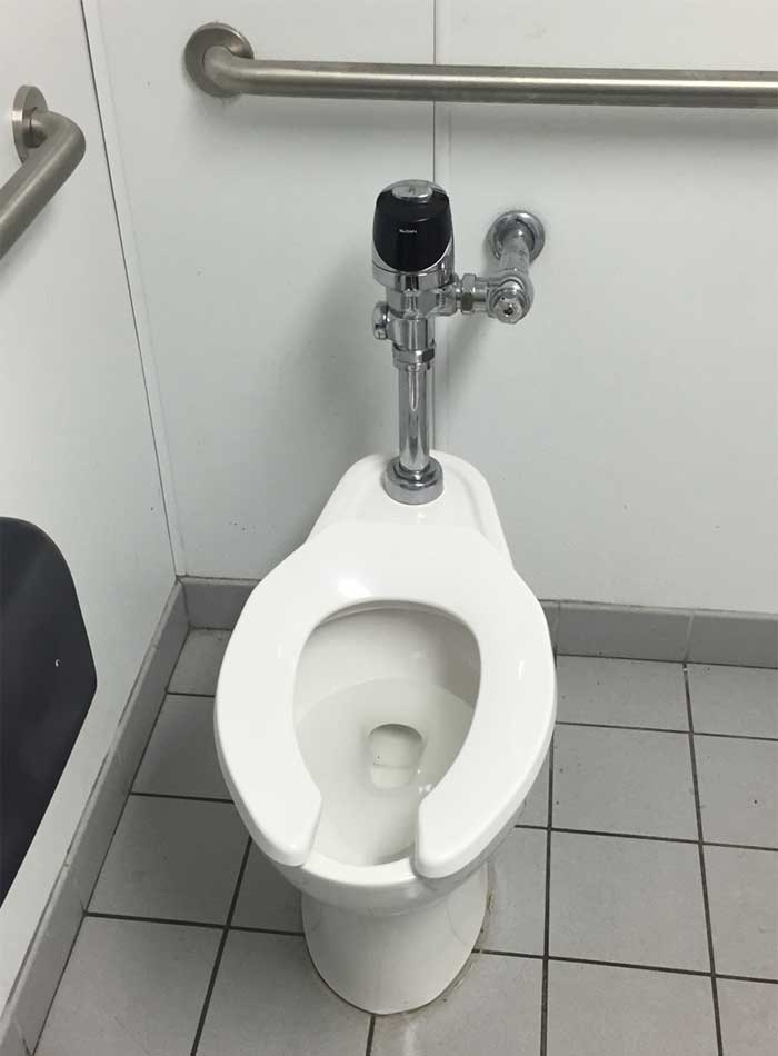 Commercial Toilet Repair Commercial toilet with a no touch flush sensor installed in a commercial facility in Tampa