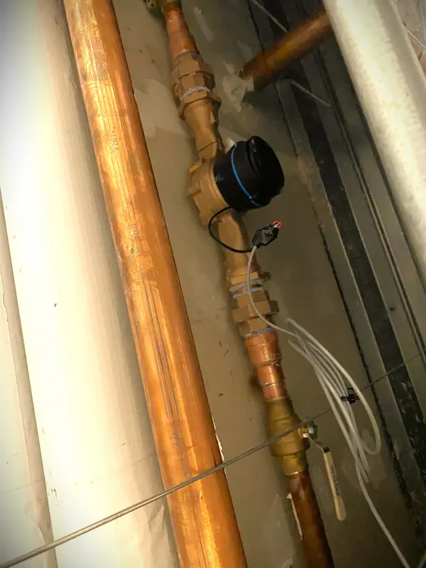 everydayplumber-commercial-copper-piping-backflow-preventer Commercial copper water supply piping with shutoff valve and backflow preventer assembly, illustrating professional commercial plumbing installation