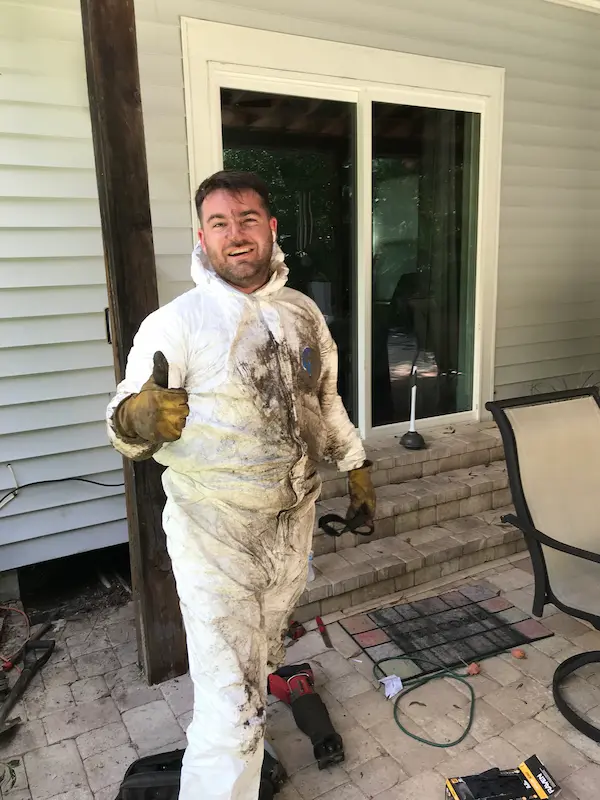 friendly-plumber-hard-work-tampa friendly plumber giving thumbs up after completing tough plumbing job in Tampa